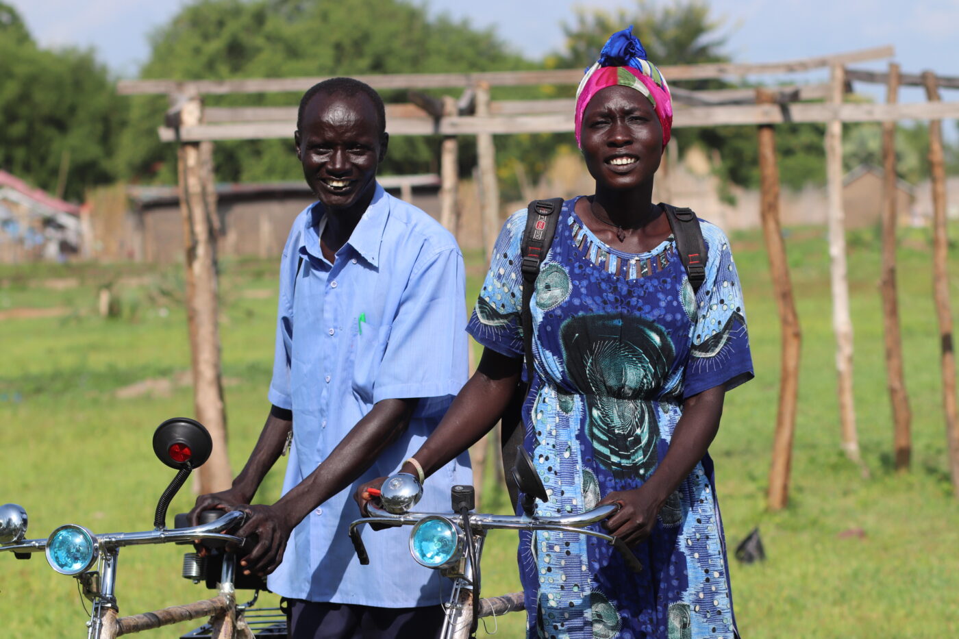 South Sudanese health worker women and men with their new bike